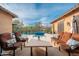 Gorgeous backyard featuring a sparkling pool, spa, and comfortable seating area for relaxation and enjoyment at 5428 E Windstone Trl, Cave Creek, AZ 85331