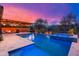 Stunning backyard with a sparkling pool, covered patio, and outdoor kitchen, ideal for outdoor entertaining at 5428 E Windstone Trl, Cave Creek, AZ 85331