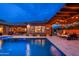 This home features a fabulous pool and a covered patio with a built-in fire pit, ideal for entertaining guests at 5428 E Windstone Trl, Cave Creek, AZ 85331