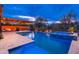 This property boasts a stunning pool and spa area, along with a built-in kitchen, making it perfect for outdoor living at 5428 E Windstone Trl, Cave Creek, AZ 85331
