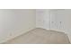 A simple, carpeted bedroom space with two double door closets for plenty of storage at 5622 N Palacio Way, Phoenix, AZ 85014