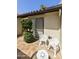 Charming courtyard area with iron furniture, lush greenery, and sliding glass doors at 5622 N Palacio Way, Phoenix, AZ 85014