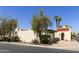 Stunning exterior view of property featuring mature trees, privacy walls, and tile roof at 5622 N Palacio Way, Phoenix, AZ 85014