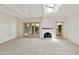 Bright living room with skylight, fireplace, and access to patio at 5622 N Palacio Way, Phoenix, AZ 85014