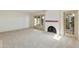 Bright living room with fireplace and access to patio at 5622 N Palacio Way, Phoenix, AZ 85014