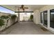 Relaxing covered patio featuring ceiling fans and access via sliding glass doors at 5622 N Palacio Way, Phoenix, AZ 85014