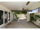 Inviting covered patio with ceiling fan and access to the yard via sliding glass doors at 5622 N Palacio Way, Phoenix, AZ 85014