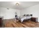 Bright bedroom with wood floors, neutral walls, and ensuite bath at 5637 N 78Th Way, Scottsdale, AZ 85250