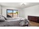 Bright bedroom with wood floors and sliding doors to outdoor space at 5637 N 78Th Way, Scottsdale, AZ 85250