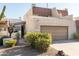 Charming home featuring a two-car garage, complemented by well-maintained desert landscaping in the front yard at 5637 N 78Th Way, Scottsdale, AZ 85250