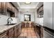 Cozy kitchen featuring wood cabinets, modern appliances, and a breakfast nook with a view at 5637 N 78Th Way, Scottsdale, AZ 85250