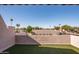 Inviting outdoor patio with artificial turf and views of mature landscaping at 5637 N 78Th Way, Scottsdale, AZ 85250