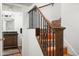Tile staircase with decorative wrought iron railing and wood banister at 5637 N 78Th Way, Scottsdale, AZ 85250