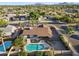 Panoramic aerial view of a desert neighborhood, home, pool, landscaping, and mountain backdrop at 5802 E Spring Rd, Scottsdale, AZ 85254