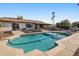 Relaxing backyard pool with patio space, desert landscaping, and covered patio attached to home at 5802 E Spring Rd, Scottsdale, AZ 85254