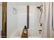 Clean white bathroom with stylish shower features a built-in shelf and modern fixtures at 5802 E Spring Rd, Scottsdale, AZ 85254