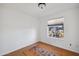 Cozy bedroom features a large window providing natural light and simple decor at 5802 E Spring Rd, Scottsdale, AZ 85254