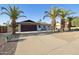 Charming single-story home with desert landscaping, mature palm trees, and a spacious two-car garage at 5802 E Spring Rd, Scottsdale, AZ 85254