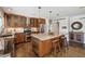 Open concept kitchen with an island, stainless steel appliances, and a seating area at 5802 E Spring Rd, Scottsdale, AZ 85254