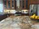 Bright kitchen with a large island, stainless steel appliances, and rich wood cabinetry at 5802 E Spring Rd, Scottsdale, AZ 85254