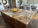 Spacious kitchen island featuring a unique marble countertop and modern cabinetry at 5802 E Spring Rd, Scottsdale, AZ 85254