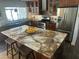 Modern kitchen with a large island, stainless steel appliances, and stylish cabinetry at 5802 E Spring Rd, Scottsdale, AZ 85254