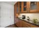 Kitchen with granite countertops, wooden cabinets, stainless steel appliances, and coffee bar at 5802 E Spring Rd, Scottsdale, AZ 85254