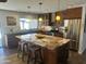 Modern kitchen with a large island, stainless steel appliances, and eat in breakfast bar at 5802 E Spring Rd, Scottsdale, AZ 85254