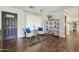 Inviting living room with hardwood floors, stylish furniture, and a view of the entry at 5802 E Spring Rd, Scottsdale, AZ 85254