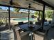 Covered patio with a dining table and an inviting view of the sparkling backyard pool at 5802 E Spring Rd, Scottsdale, AZ 85254