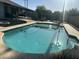 Refreshing pool surrounded by desert landscaping and a covered patio, ideal for enjoying sunny days and outdoor living at 5802 E Spring Rd, Scottsdale, AZ 85254