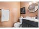 Cozy bathroom with decorative accents, a modern sink, and stylish mirror at 6819 E Sheena Dr, Scottsdale, AZ 85254