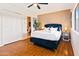 Spacious bedroom featuring hardwood floors and a bright window for lots of natural light at 6819 E Sheena Dr, Scottsdale, AZ 85254