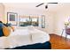 Inviting bedroom with hardwood floors, decorative accents, and a bright window for lots of natural light at 6819 E Sheena Dr, Scottsdale, AZ 85254