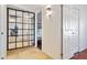 Bright hallway with a mirrored wall leading to bedrooms, providing depth and natural light at 6819 E Sheena Dr, Scottsdale, AZ 85254
