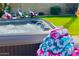 Relaxing hot tub with fresh towels, surrounded by a well-manicured lawn at 6819 E Sheena Dr, Scottsdale, AZ 85254