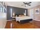 Comfortable main bedroom features modern lighting and a dark accent wall at 6819 E Sheena Dr, Scottsdale, AZ 85254