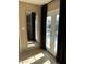 Sunroom with pool view through french doors, tile floors and black curtains at 6819 E Sheena Dr, Scottsdale, AZ 85254