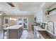 Bright kitchen featuring stainless steel appliances, white cabinets, and views to the private backyard at 8135 N Central Ave # 1, Phoenix, AZ 85020