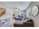 Bright living room featuring a large sectional sofa, and staircase at 8135 N Central Ave # 1, Phoenix, AZ 85020