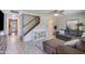 Comfortable living room with neutral colors, ceiling fan, and staircase at 8135 N Central Ave # 1, Phoenix, AZ 85020
