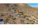 Remote hillside property with a pool and desert landscaping, providing a secluded retreat with panoramic views of the mountains at 8752 E Range Rider Trl, Mesa, AZ 85207
