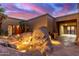Backyard oasis features a unique rock fountain and landscaping at 8752 E Range Rider Trl, Mesa, AZ 85207