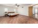 Bright bedroom featuring terracotta tile flooring, neutral walls, and two windows at 8752 E Range Rider Trl, Mesa, AZ 85207