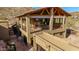 Stunning exterior of this multi-level home features desert landscaping and unique architectural details at 8752 E Range Rider Trl, Mesa, AZ 85207