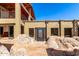 Desert home under construction with custom door and mountain views at 8752 E Range Rider Trl, Mesa, AZ 85207