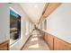 Well-lit hallway with seating and large windows overlooking the desert landscape at 8752 E Range Rider Trl, Mesa, AZ 85207