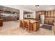 Open-concept kitchen showcasing a large center island, custom cabinetry, and modern stainless steel appliances at 8752 E Range Rider Trl, Mesa, AZ 85207