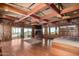 Spacious main bedroom showcasing exposed beams, fireplace, and access to scenic views at 8752 E Range Rider Trl, Mesa, AZ 85207