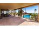 Covered patio with desert views and access to the pool at 8752 E Range Rider Trl, Mesa, AZ 85207